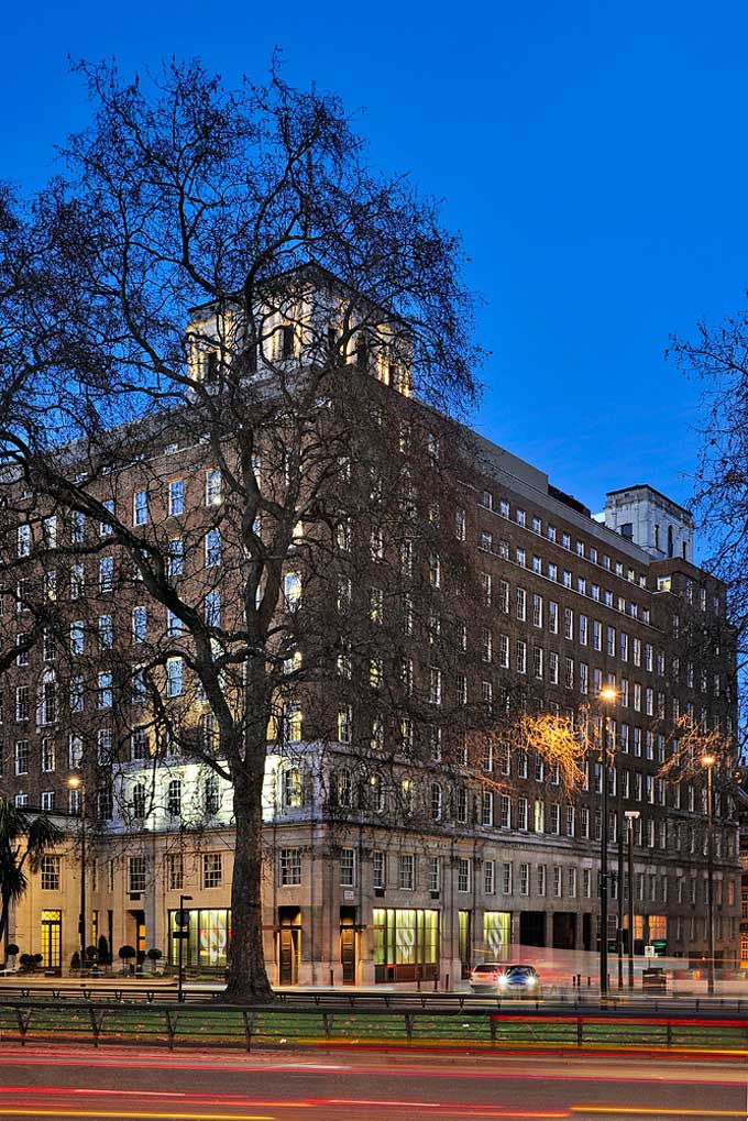exterior photo of Grosvenor House Apartments on Park Lane in evening