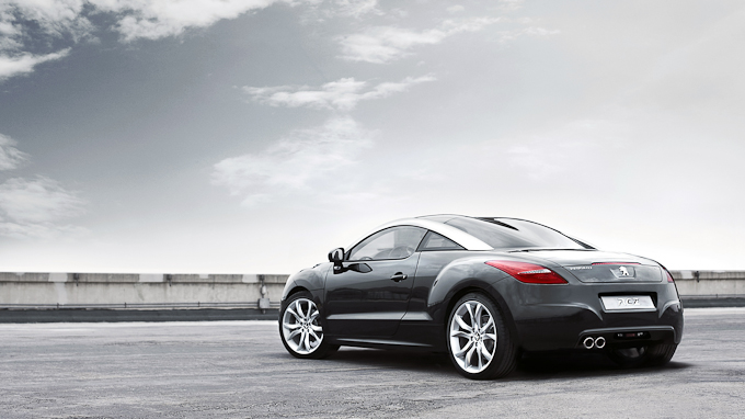 image of the backside view of a black Peugeot RCZ